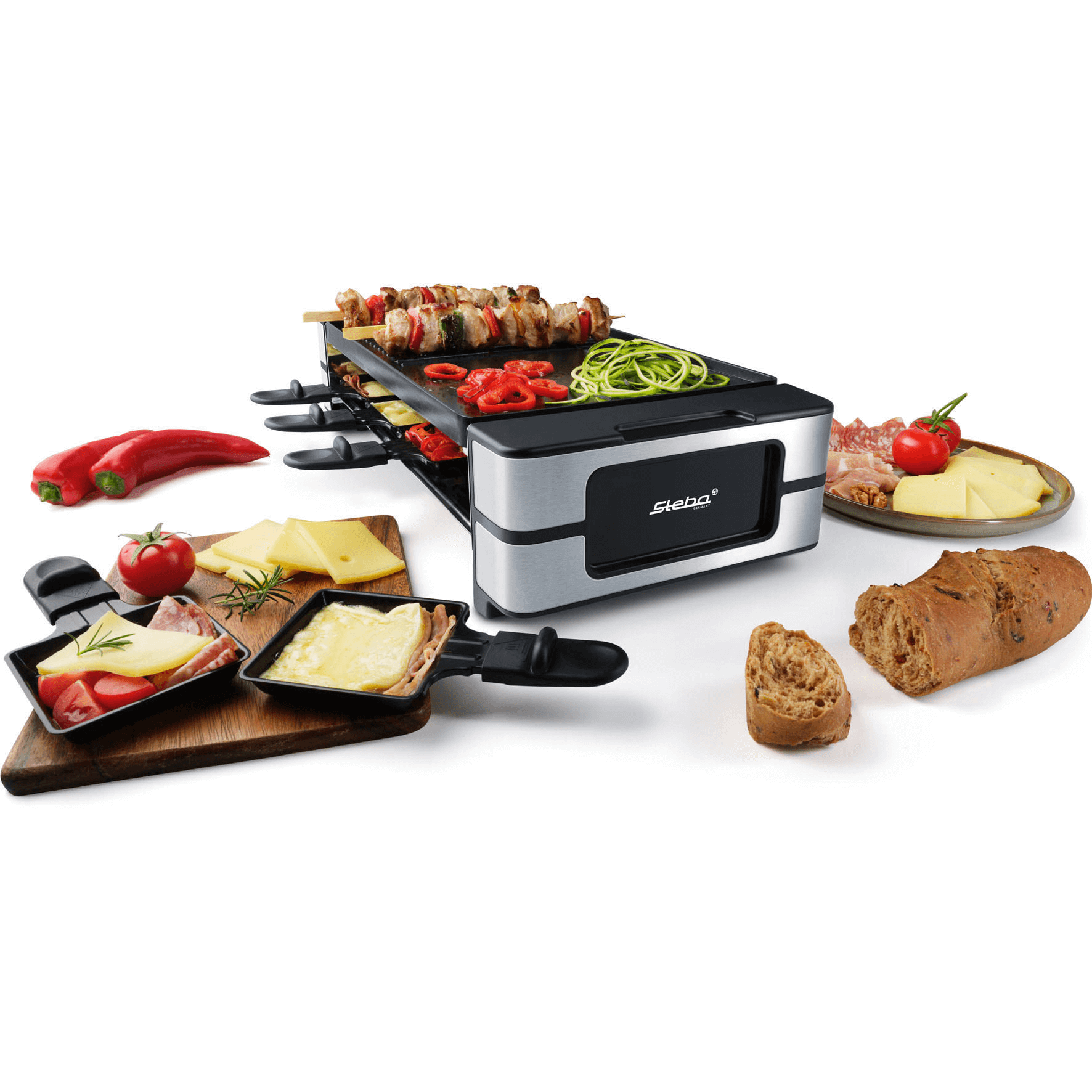 Raclette-Grill von Steba mit Grillfläche, Pfännchen, Gemüse, Fleisch und Brot für geselliges Kochen und Essen.